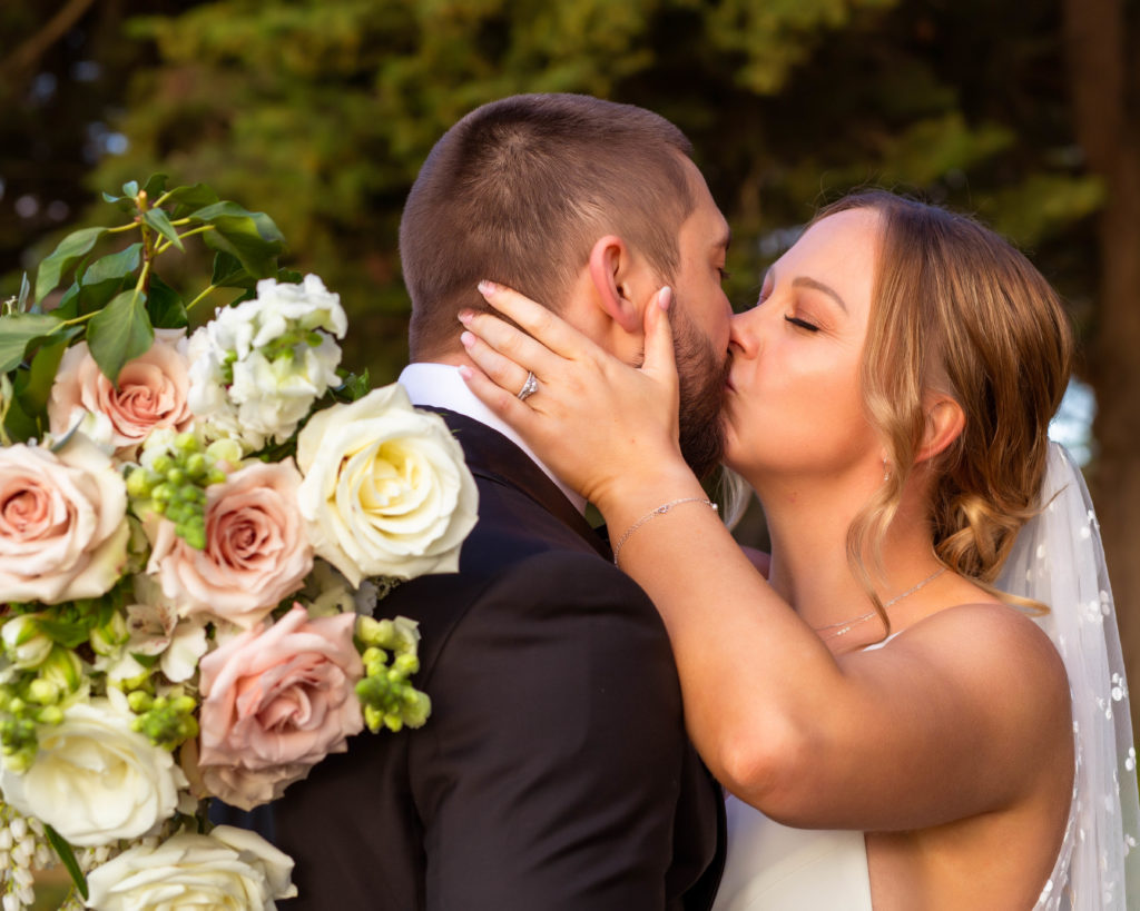 A couple kissing at a Vineyard Wedding at Dromana Estate Victoria